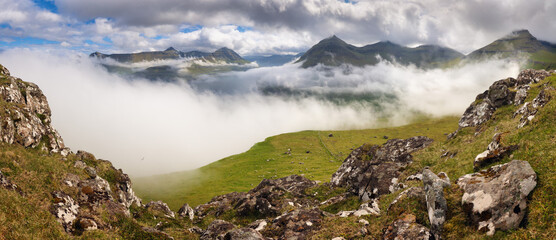 Foggy day view of Funningur village, Faroe Islands, Denmark, Europe. Picturesque summer scene of Eysturoy island. Beauty of nature concept background.