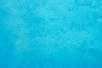 Blue concrete stone texture for background in summer wallpaper. Cement and sand wall of tone vintage. Concrete abstract wall of light cyan color.