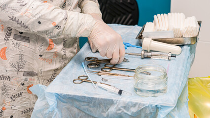 Surgeon is using surgical operation tools in operating room
