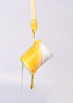Sugar paste for sugaring with a white jar. Sugaring. Depilation and beauty concept.