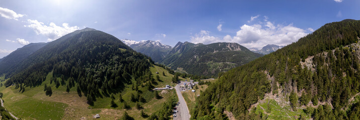 Aerial view of meandering road vantage viewpoint lookout in mountains of French Alps with Mont...