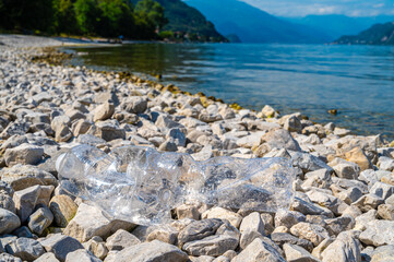 Plastic bottle abandoned in the environment. Plastic pollution and waste recycling.
