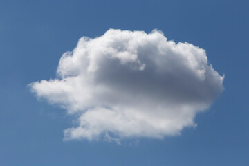 white fluffy cloud in a blue sky