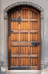 old wooden entrance door with antique door handle