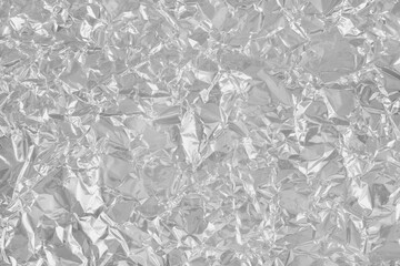 Silver foil leaf shiny texture, abstract grey wrapping paper for background and design art work.