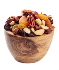 Mix of nuts and dried fruits isolated on a white background.