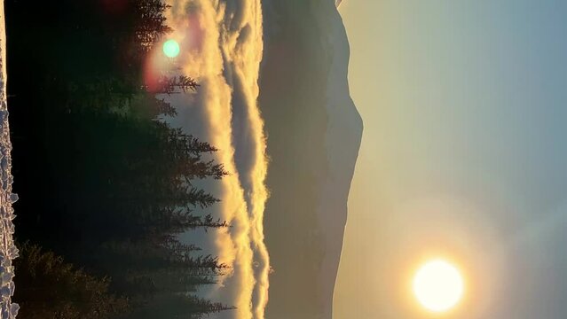 Multi-colored dawn in the mountains with clouds and trees. Hike to the top of Hoverla. We welcome morning