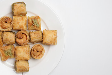 Layered stuffed pastry Baklava middle eastern sweet dessert on white background
