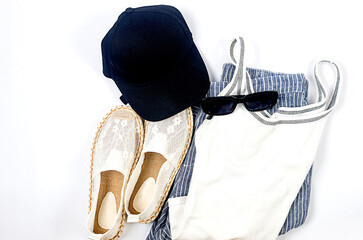 Set of seasonal summer fashion woman clothes, top view. Women's summer outfit.