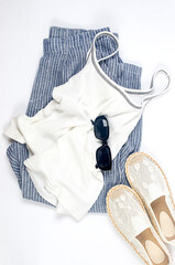 Set of seasonal summer fashion woman clothes, top view. Women's summer outfit.
