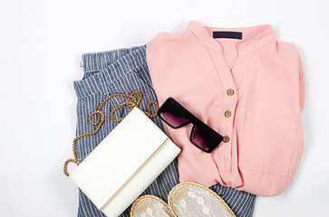 Set of seasonal summer fashion woman clothes, top view. Women's summer outfit.