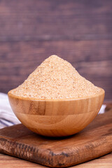 Breadcrumbs on wood background. Breadcrumbs flour in wooden bowl. Close up