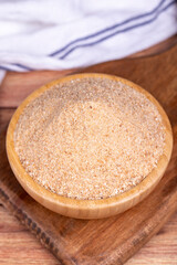 Breadcrumbs on wood background. Breadcrumbs flour in wooden bowl. Close up