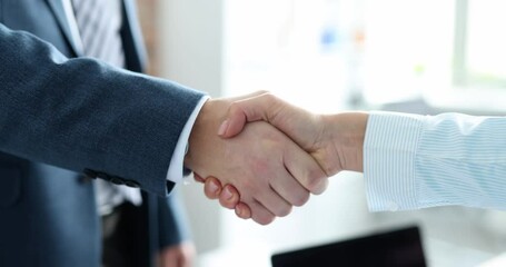 Closeup of business partners handshake in office 4k movie slow motion. Profitable deals concept