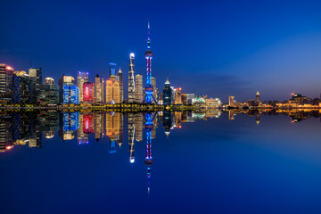 Fototapeta na wymiar Beautiful Shanghai skyline and modern buildings scenery at night, China. modern city buildings and water reflection.