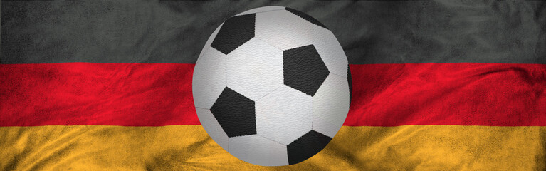 soccer ball against the background of the national flag of Germany