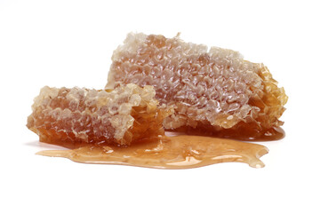 Sticky liquid honey natural geomatic hexagon honeycomb macro closeup on white background