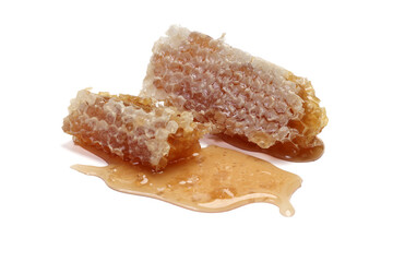 Sticky liquid honey natural geomatic hexagon honeycomb macro closeup on white background