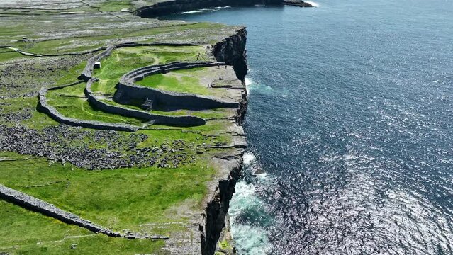 Drone flying along the cliff edge at Dun Angus Inis More Aran Islands Ireland on a fantastic May Day