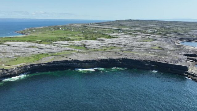 Drone flying in from the Atlantic Ocean over the sae cliffs of Inis More Aran Islands West Of Ireland
