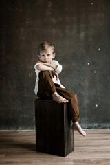 boy, blond, white shirt, baby photo, studio photography, noise, blurred background, photo studio