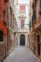 Narrow street in the historical center of Venice, Italy, Europe.