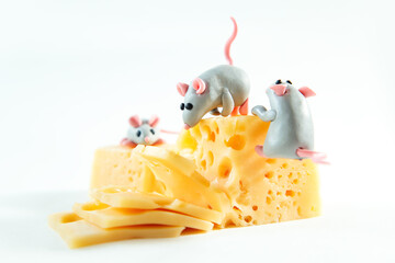 Little plasticine mice and a piece of cheese with holes.