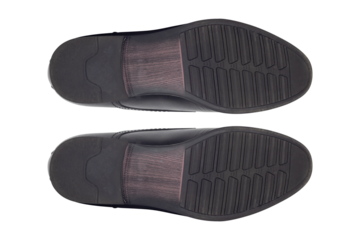 footprints, classic men's black leather shoes bottom view isolated from background