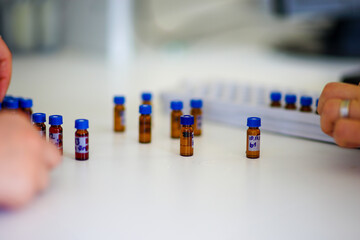 close up of a person holding a tube