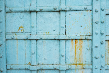Metal painted blue fence with rust. Grunge, retro style