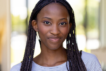 Portrait of happy african american woman looking at camera and smiling