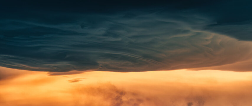 Dramatic asperitas cloud and dark sunset sky