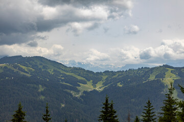 Valley of tourist town Les Gets outdoor sports holiday destination surrounded by the green French Alps seen from the top of the Belvedere mountain