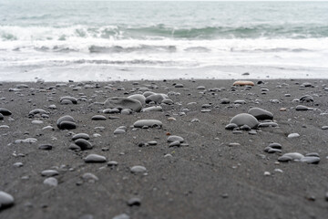 Fototapeta na wymiar Waves washing against Reynisfjara Black Sand Beach In Iceland