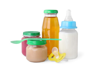 Healthy baby food, bottles with juice, milk and pacifier on light grey background