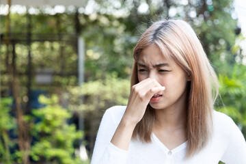 Concept of Cold and Flu, Sick Asian Woman Sneezing with Runny Nose, Healthcare Image