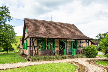 Fototapeta na wymiar Half-timbered house of german immigrants in the countryside of Pomerode, Santa Catarina in Brazil