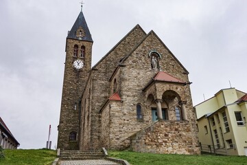 Fototapeta na wymiar Kostel sv. Jana Krtitele church of John the Baptist in Zajeci, Czech Republic with its clock tower