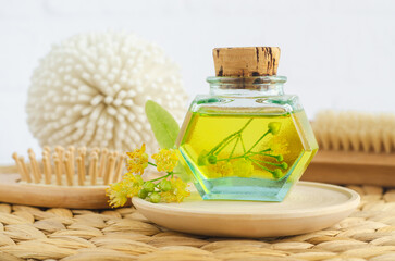 Small vintage bottle with linden (tilia, basswood, lime tree) oil. Natural skin care, homemade spa and beauty treatment.