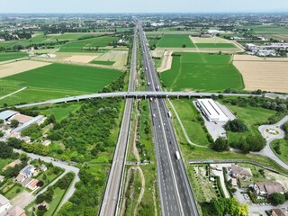 Image of car and truck traffic on the Italian highway A1 also called the Autostrada del Sole...