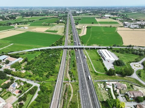 Image of car and truck traffic on the Italian highway A1 also called the Autostrada del Sole between Reggio Emilia and Parma