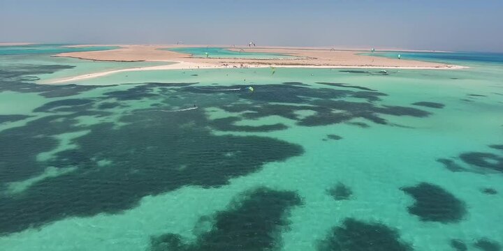 Kitesurfing in ocean waves, freestyle kiteboarding with wind on kite wing