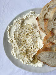 Yoghurt labnah with bread on white background