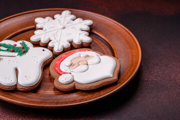 Beautiful delicious Christmas gingerbread on a concrete texture background