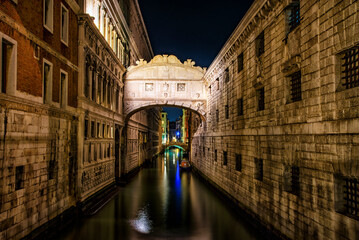 Fototapeta na wymiar Night scene in a canal of Venice
