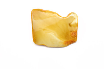 Matte amber on the white background. Sun stone. Fossil fossilized resin. semi-precious mineral. Natural material for jewelry. Copal. Science.  Polished amber stone. Fly and mosquito
