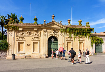 Obraz premium Tourists in line to take a look at St. Peter's basilica in Vatican through keyhole on Knights of Malta square, Rome, Italy