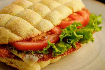 Sandwich made with corn flour with tomatoes, lettuce, chicken schnitzel for restaurant menu