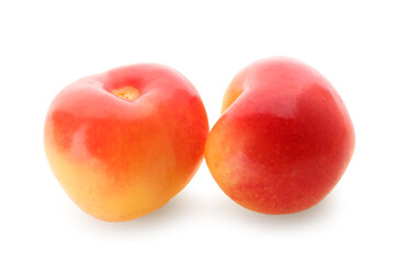 Sweet yellow cherries on white background