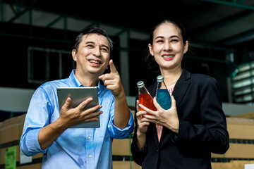 Customer visits a warehouse or factory in order to drink purchase decision. Owner explaining Products to customer. Checking goods quality for import and export. Drink factory production line beverage